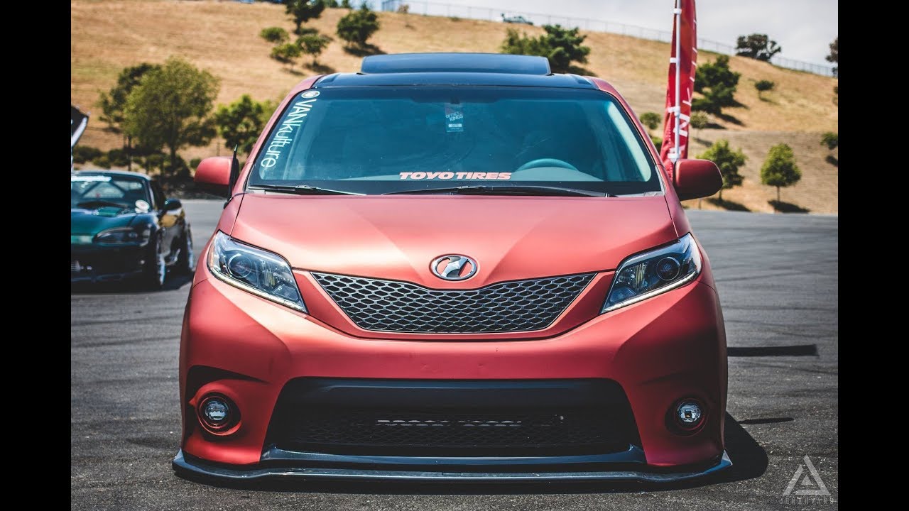 Red Toyota Sienna with custom front bumper, front three-quarter view